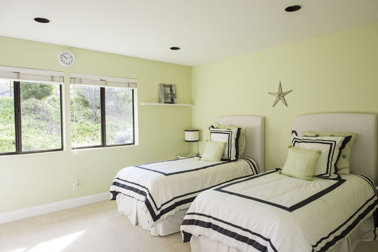 In addition to the robot, a REX employee is also on site during home showings and can provide information about rooms, including this bedroom.